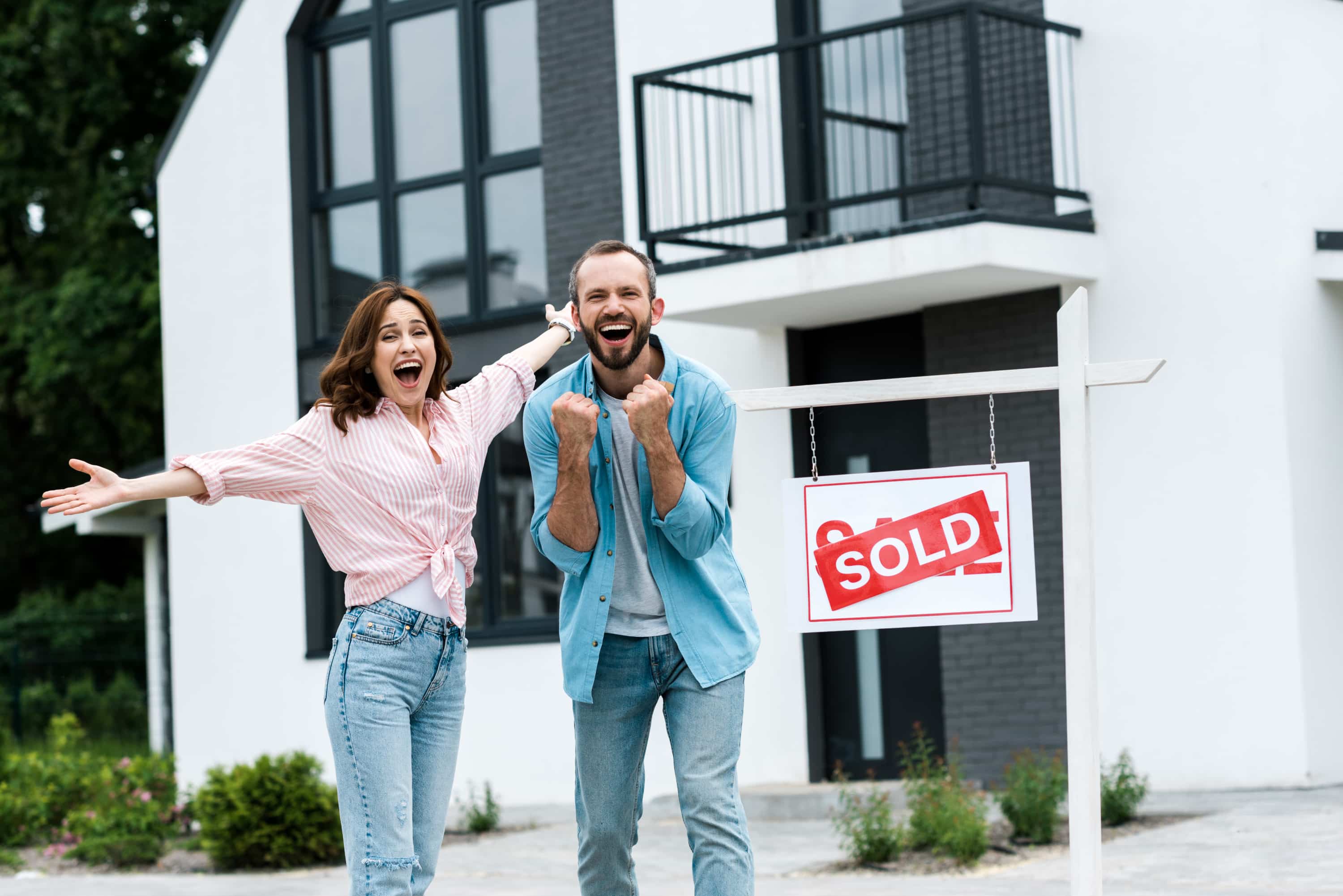 Excited couple who just sold their home